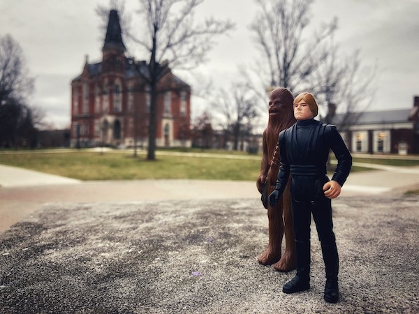 Luke Skywarlker and Chewbacca action figures with East College background