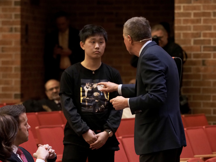 John Kasich talking with a student