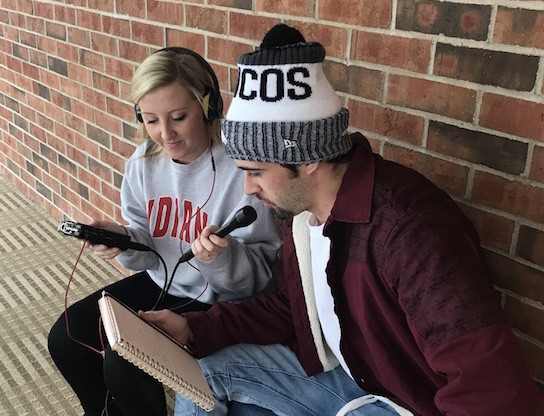 Students recording a podcast