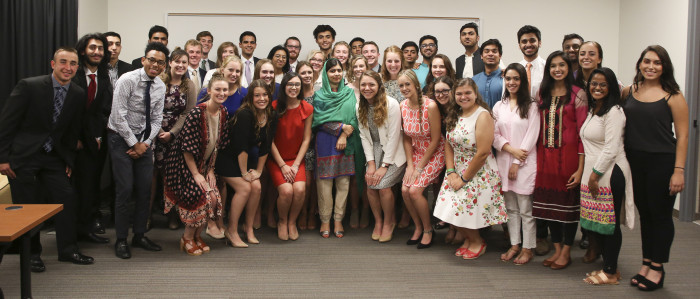 Malala Yousafzai posing with a group of students