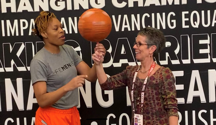 Dianna Minnick Boyce learns to spin a basketball