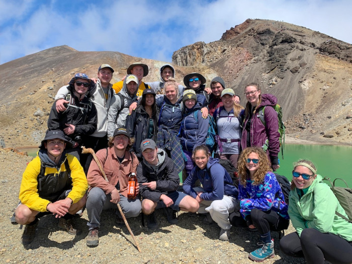 Students gather for a group photo at the Tongariro Crossing in New Zealand