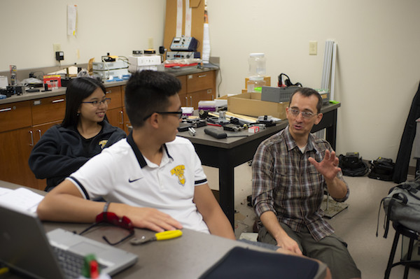 Jacob Hale collaborating on droplet research with students