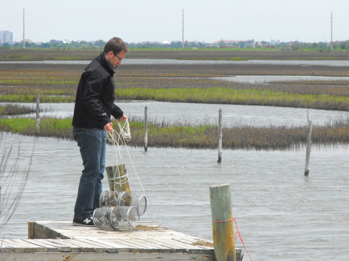 Elias Oziolor conducting research near water