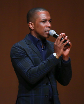 Closeup of Leslie Odom Jr. with microphone during the Ubben Lecture