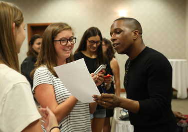 Leslie Odom Jr. talking with students