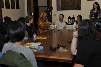 Leymah Gbowee talking with students across a table
