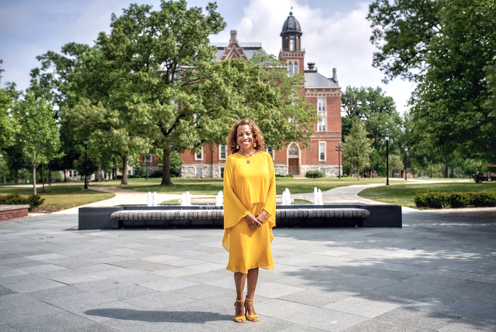 Dr. White stands in front of East College