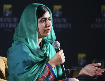 Closeup of Malala Yousafzai with a microphone
