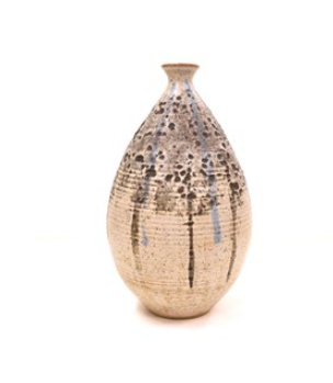 Cream vase with black and light blue drip lines with black smudges and dots