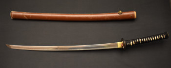 Japanese katana with brown leather sheath