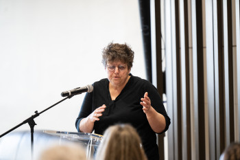 Woman speaking at a podium
