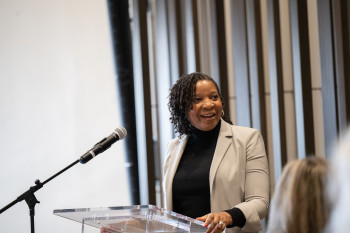 Woman speaking at a podium