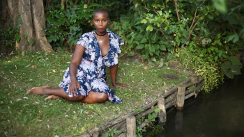  woman sitting on grass