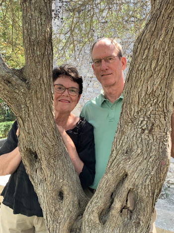 Stan and Bobbie Hendricks Bahler behind a tree