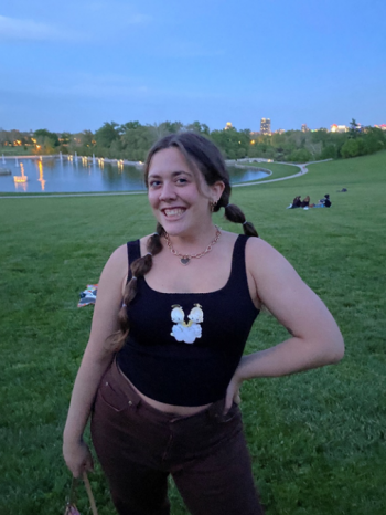 Alicia Detterman smiling with a park lake background