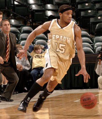 Austin Brown dribbling during a basketball game