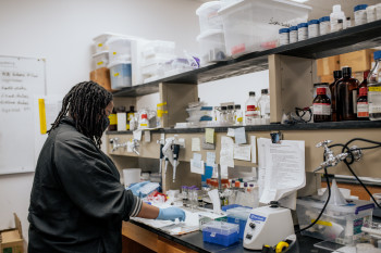 Student at a desk in a lab