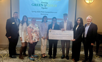 Growing Green and Gold pitch competition winners holding a check