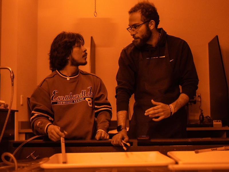 two males in photo darkroom