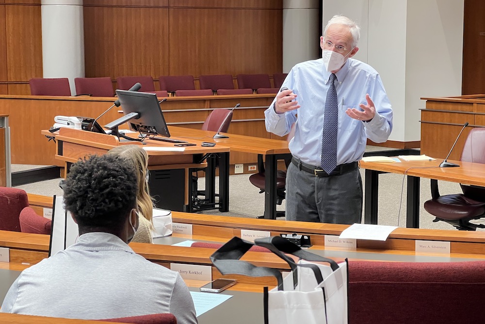 Students get an introduction to law school classes from former Associate Justice Frank Sullivan.