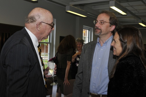 Dr. Kevin Moore and wife Harriett Moore visit with Dr. Asher