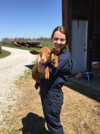 Emily Vincent holding a goat