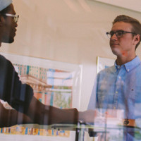 two men shaking hands