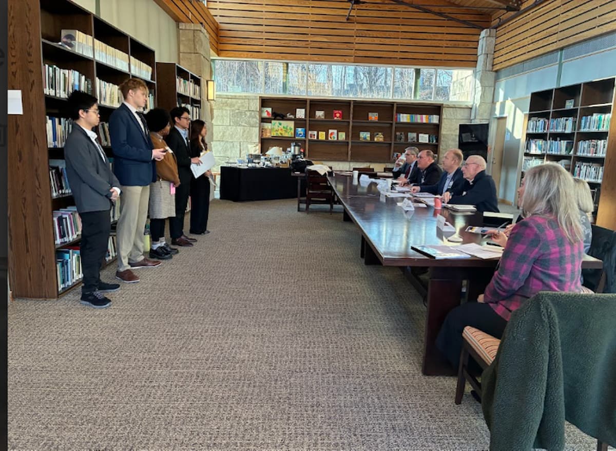 Students work in teams on Friday night to address the unfolding crisis