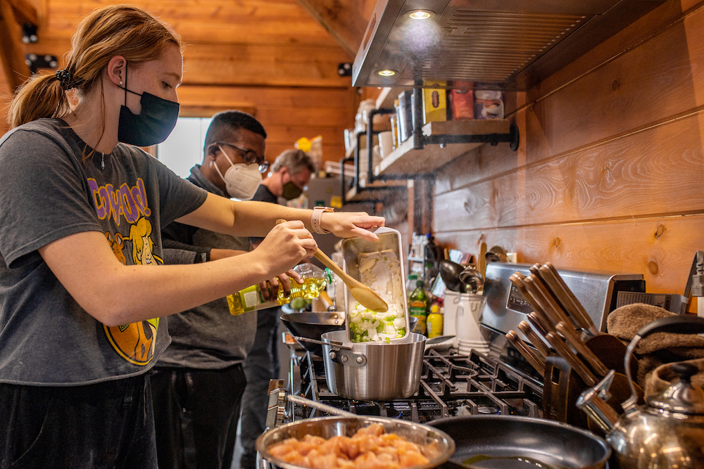 students learn to cook at the campus farmhouse