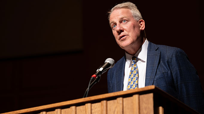 Male speaking at podium