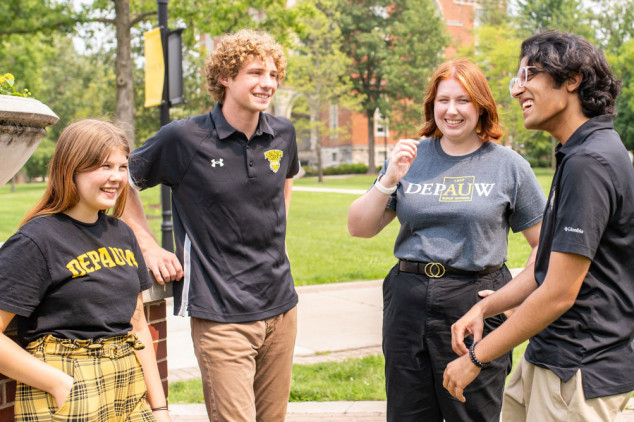 male and female students in depauw shirts talking and laughing