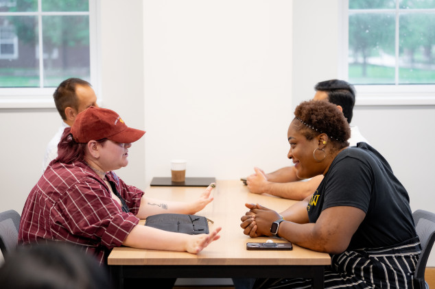Student and professor engaging in conversation