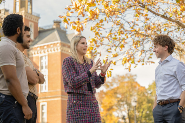 Lindsay Gramlich talking to students outside of East College
