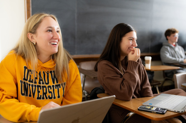 Two students smiling in class