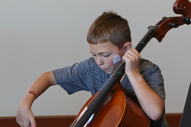boy playing cello