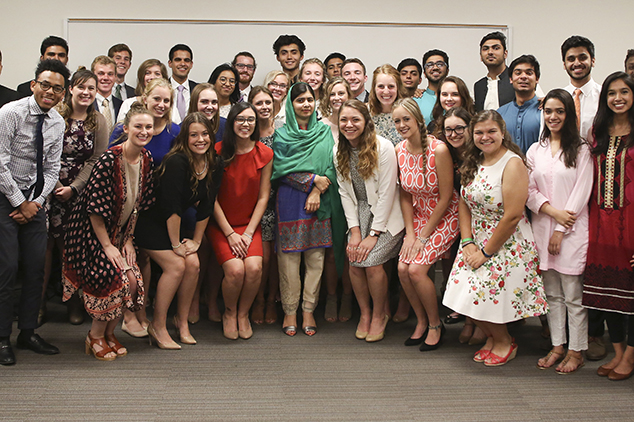 Malala Yousafzai posing with students following an Ubben Lecture