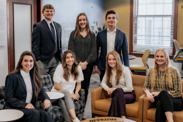 Students from the management fellows group smiling