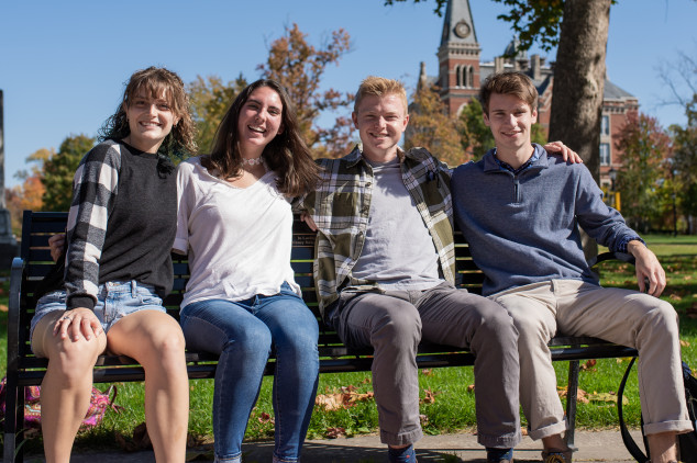 students sitting together on a bench