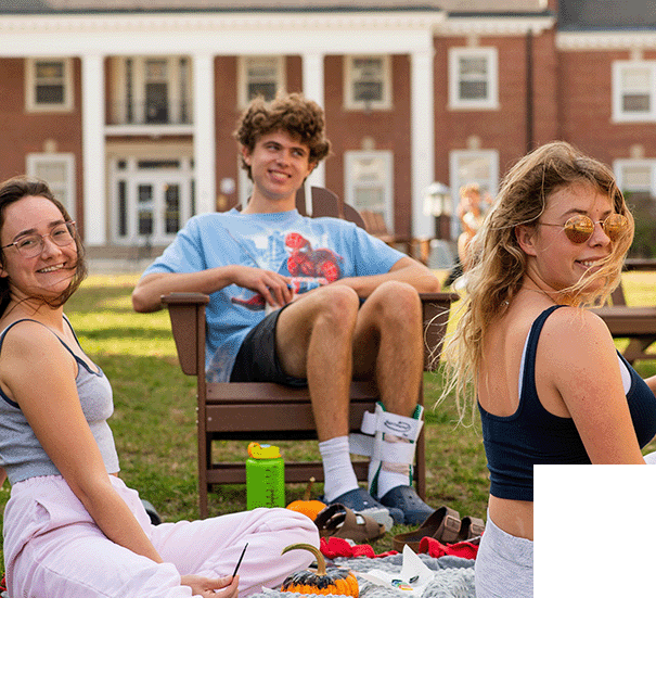 Students seated on the quad