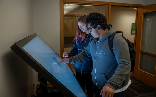 Students exploring touchscreen technology at the Tenzer Center