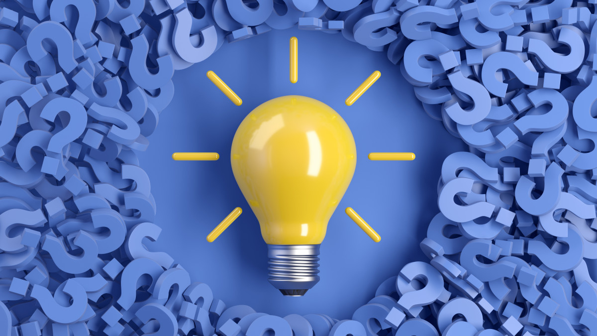 Magazine cover graphic: blue question marks surrounding a lightbulb