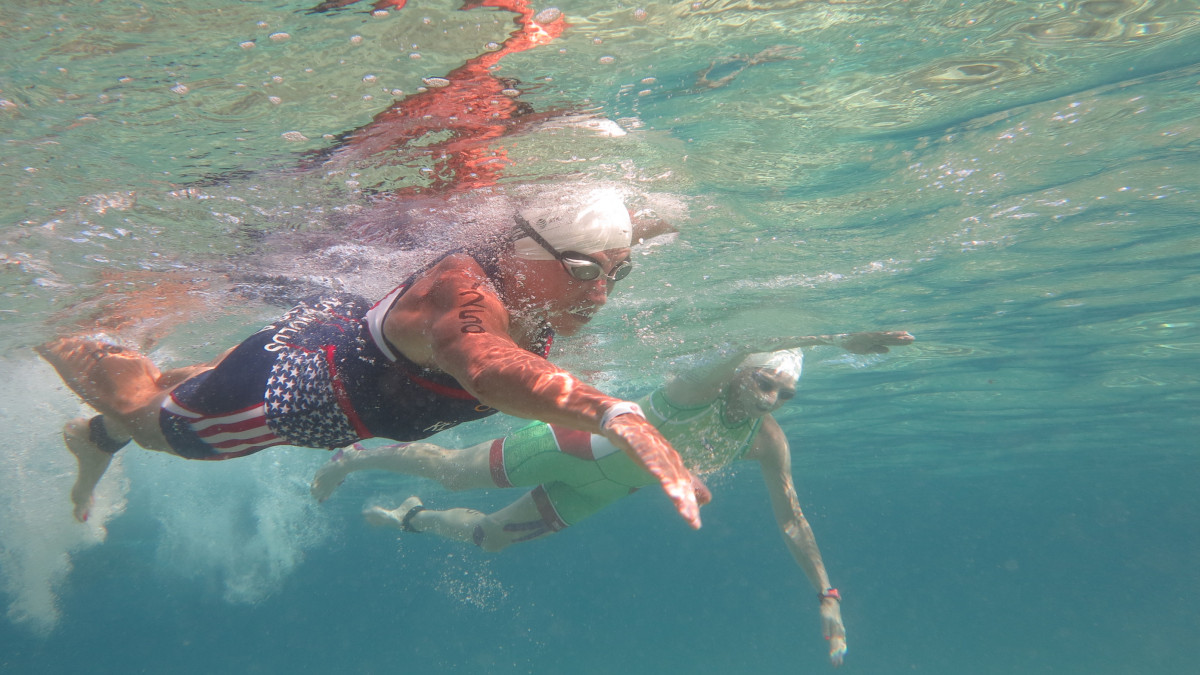 Sue Engle Reynolds '76 swimming during triathlon