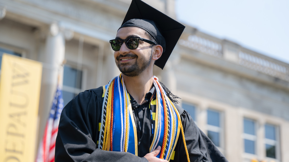 Student receives diploma during commencement