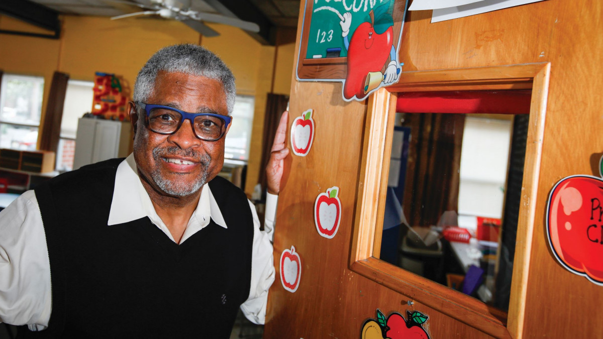 Edward Greene '71 stands in the doorway of a preschool