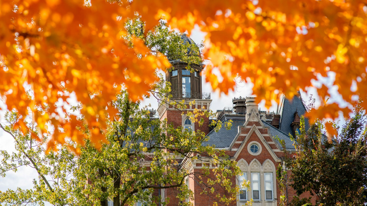 East College surrounded by fall leaves