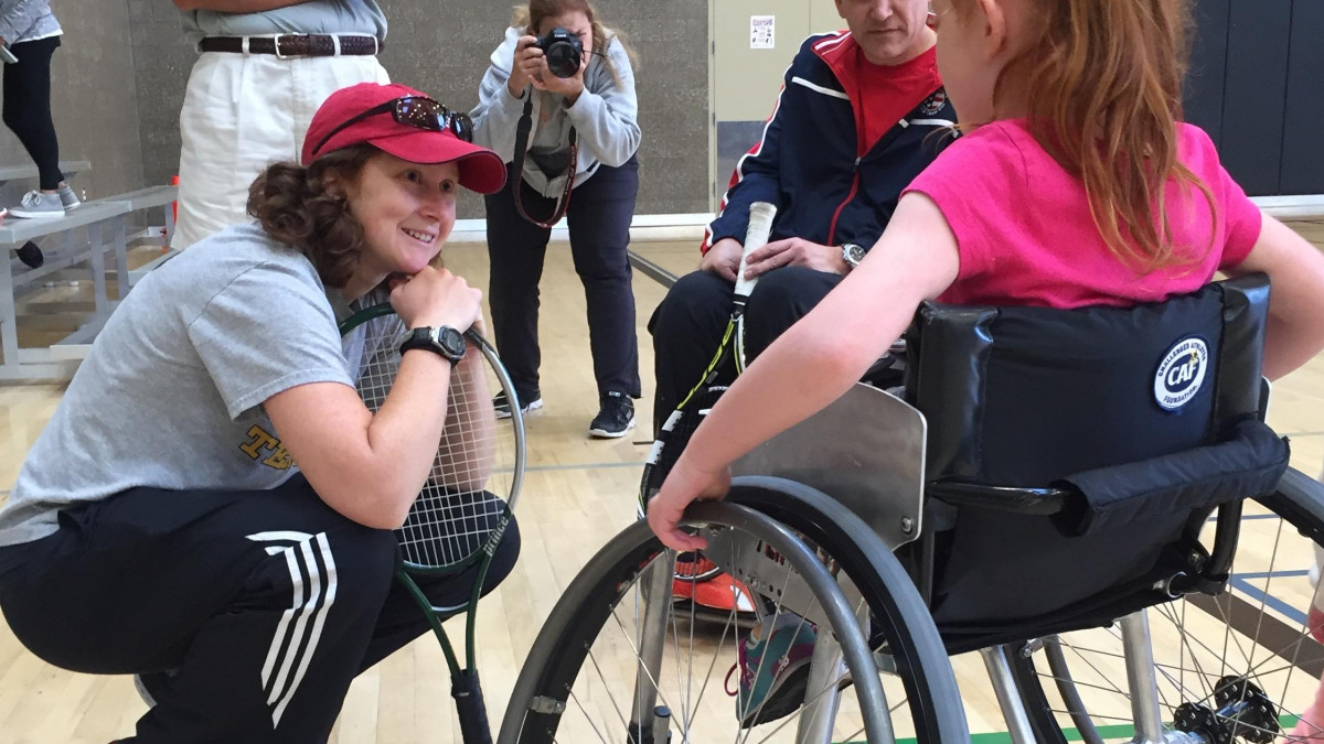 Dr. Erin Andrade coaches wheelchair tennis and treats people with disabilities. 