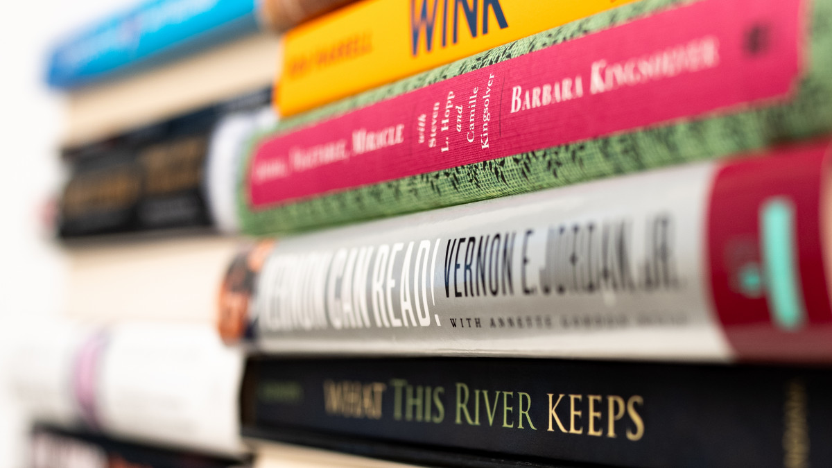 Stack of books written by DePauw alums