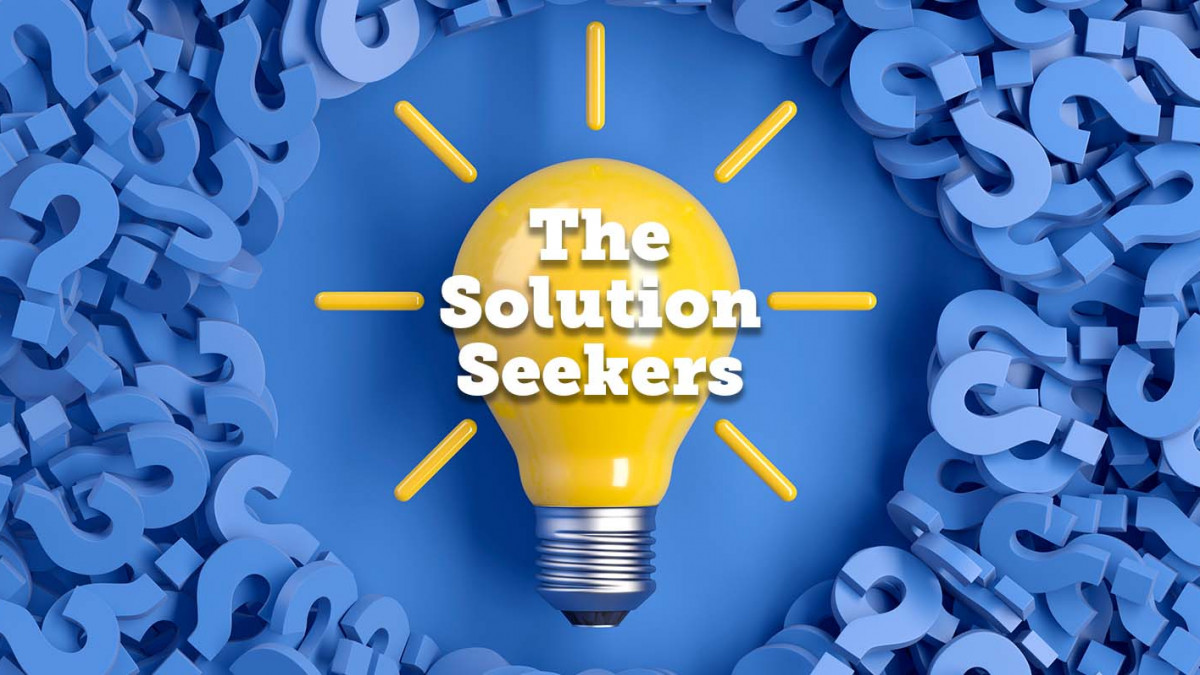 DePauw Magazine:  The Solution Seekers - featuring blue question marks and a yellow light bulb