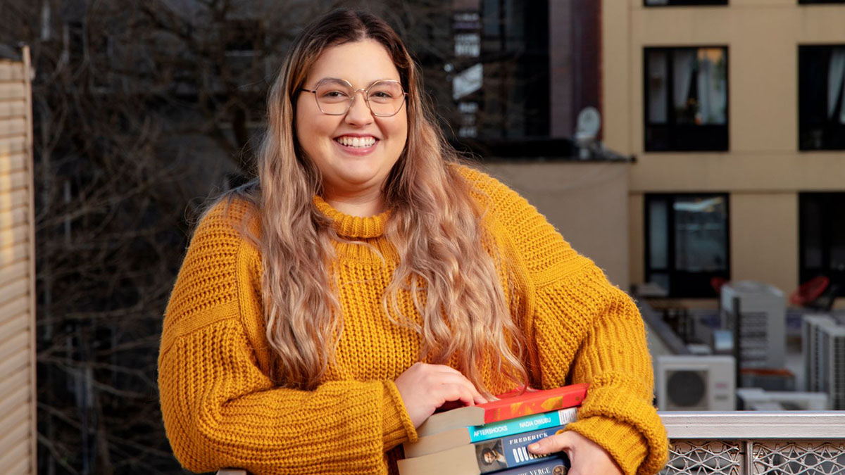 Maria Mendez '19 poses in NYC with books